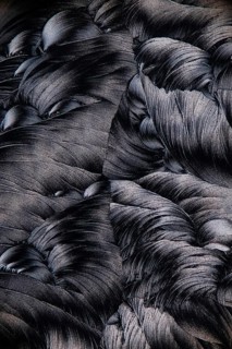 Close-up image of salicylic acid microcrystals, viewed under a microscope, depicting an intricate