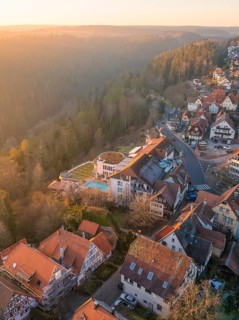 Half-timbered houses in a village in a hilly landscape at sunrise, Zavelstein, Calw district, Black