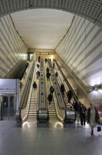 People on escalator Elizabeth Line, Liverpool Street underground railway station, London, England,