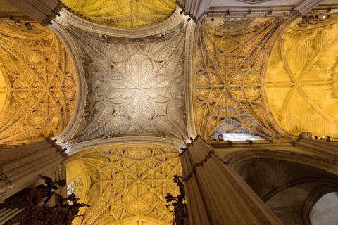 Large Gothic vault in the interior of the cathedral with finely worked ceiling, Seville, Andalusia,