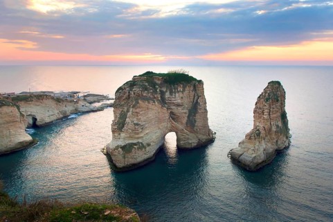Sunset landscape view of the Pigeon Rocks along the famous Mediterranean Sea front Corniche in the