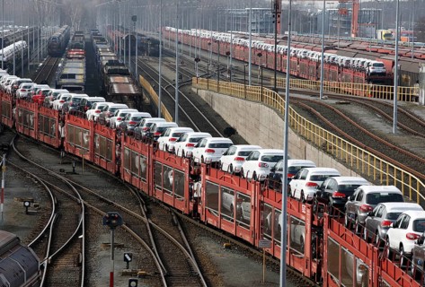 Wolfsburg, DEU, 250211 - Car transport wagons with new Volkswagen Golf and Tiguan vehicles on the