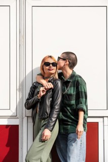 A Colombian lesbian couple embraces outdoors. They exude love, confidence, and identity,