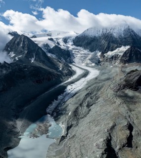 Aerial view, Alpine panorama, mountain landscape with glacier tongue Glacier de Cheilon and summit