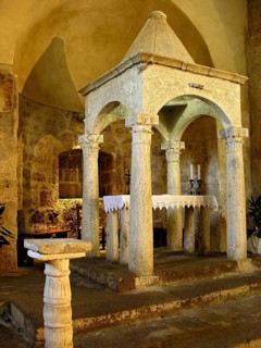 Pre-Romanesque ciborium in white marble stone, superstructure above altar, Romanesque church Chiesa