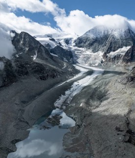 Aerial view, mountain landscape with glacier tongue Glacier de Cheilon and summit Mont Blanc de