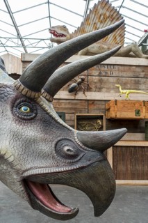 Giant dinosaur replicas on display at the Berkenhof Tropical Zoo, amusement and animal park near