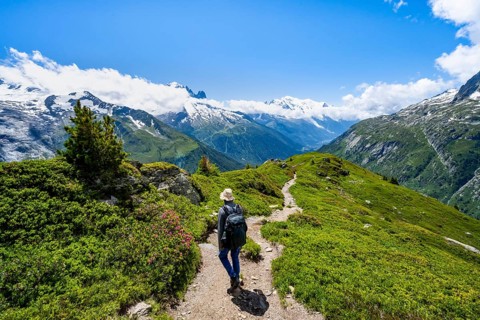 Mountaineers on hiking trail, mountain panorama with glaciated mountain peaks, Aiguille du Midi and