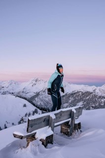 Summit bliss in the snow-covered winter landscape in the Tannheimer Tal in the Alps on the
