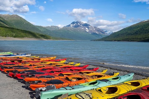 Colorful kayaks on lakeside, lake and mountains, Eklutna Lake, Chugach Mountains, Chugach State
