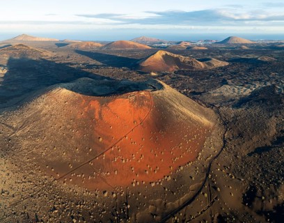 Picturesque volcanic landscape with volcanic craters and lava fields in morning light, Caldera