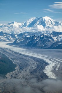 Clouds over high mountains, Mt Foraker with Kahlitna Glacier, aerial view, Alaska Range, Denali