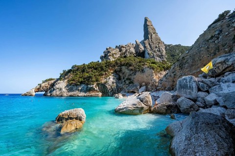 Light blue clear sea on a dream beach on Cala Goloritzé, picturesque rocky coast, steep coast with