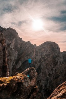 A hiker at the top of the mountain of Aiako Harria or Peñas de Aya in the town of Oiartzun,