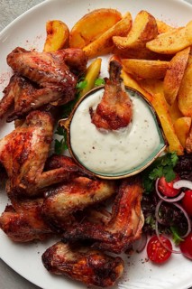 Fried chicken wings, with potatoes, and spices, homemade, fast food, no people