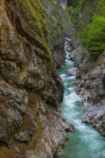 The Lammer creek is flowing fast through the Lammerklamm on a sunny hiking day
