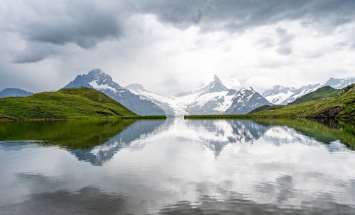 Mittelhorn and Schreckhorn peaks with Upper Grindelwald glacier are reflected in the Bachalpsee