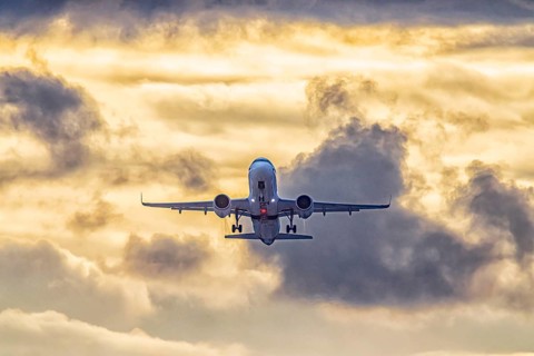 Stuttgart airport with plane taking off. Eurowings Airbus A320 in front of dark clouds, lighting in