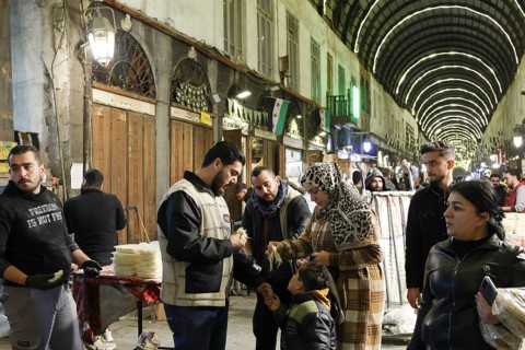 Syrians shop at the historic Al-Hamidiyah Bazaar adjacent to the Umayyad Mosque during the early