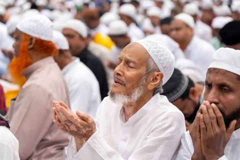 Muslims attend to Eid al-Fitr prayer at Eidgah, on March 21, 2026 in Guwahati, India. Muslims make