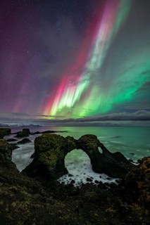 Northern lights over rock structure, coast near Arnarstapi, Snäfellsnes peninsula, Snæfellsnes,