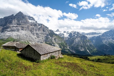 Mountain hut, alpine huts with shingles, picturesque mountain landscape, Grindelwald, Bernese Alps,
