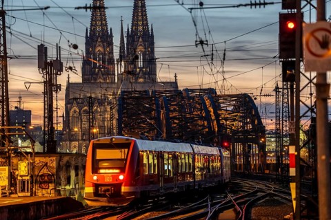 Rail track in front of Cologne Central Station, Hohenzollern Bridge across the Rhine, regional