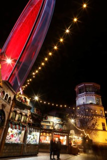 Christmas market with a ferris wheel on Burgplatz square, historic town centre, Dusseldorf, North