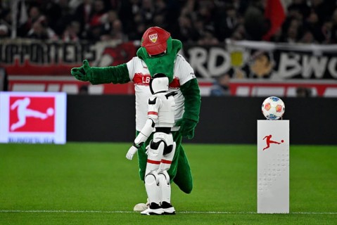 During the DFL and VfB Stuttgart Innovation Matchday, an AI-supported robot hands over the Adidas