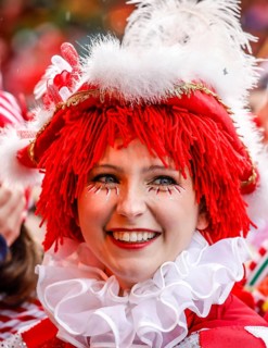Colourfully costumed carnivalists celebrate carnival in Cologne, on Weiberfastnacht the street