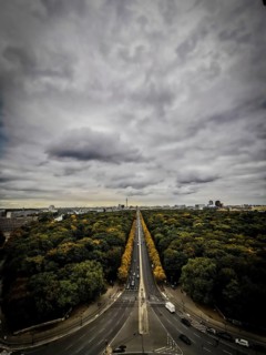 Dramatic sky over a tree-lined avenue in Berlin, view from Victory Column, Berlin