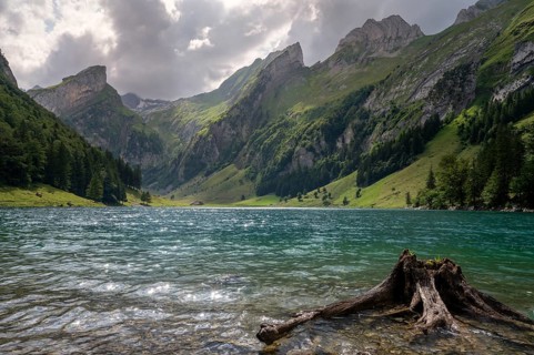 Breathtaking view of Seealpsee, Switzerland, with crystal-clear water, surrounded by majestic