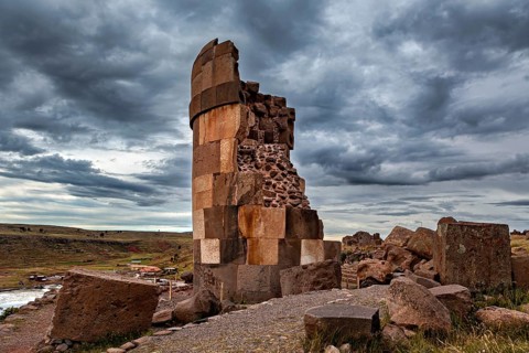 A partially preserved stone tower in an abandoned area, The Chullpas of Sillustani near Puno in