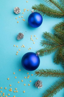 Christmas or New Year composition. Decorations, blue balls, cones, fir and spruce branches, on a