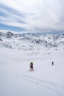Ski tourer in mountain landscape with snow, ascent to Grialetsch Scharte, Bündner Haute Route,