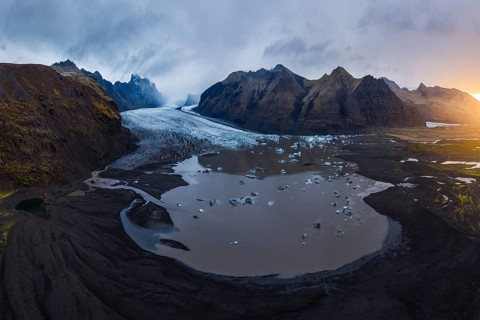 A stunning aerial view showcasing the expansive Vatnajökull Glacier as it flows into a glacial