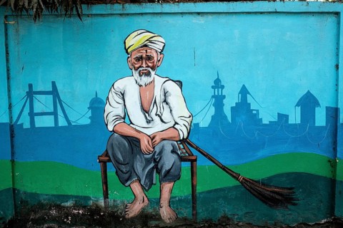 Mural painting representing an old man with a broom, Odisha, India