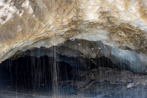 Meltwater at a glacier cave, underground glacier stream, Castner Glacier, Delta Range, Alaska