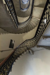Staircase around 1900 with a wrought-iron banister, in a residential building, Genoa, Italy