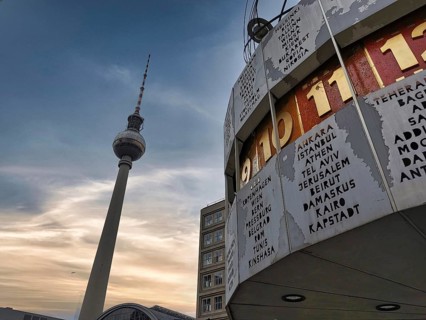 Cloudy sky over the Berlin World Clock and the Berlin TV Tower at Alexanderplatz, Alex, Mitte,