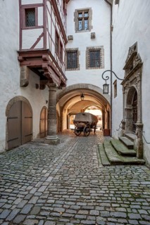 Horse-drawn carriage in the inner courtyard of the Gothic part of the town hall, old town hall