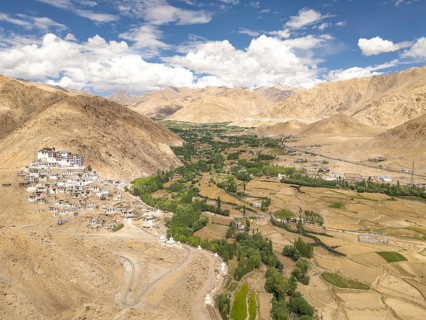 Aerial view of Chemrey Gompa nestled in the arid mountains of Ladakh, India. This ancient Buddhist