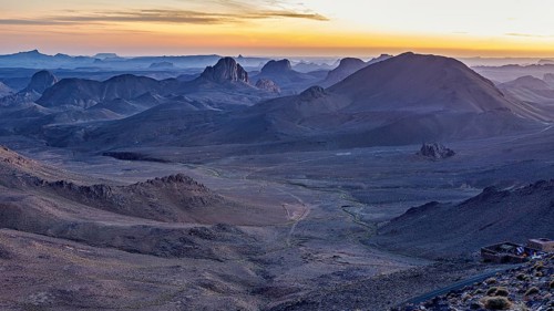 Morning mist over a vast desert landscape at sunset, The landscape of the Ahaggar Mountains in the