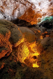 Underground cave formed by lava flow, illuminated lava tunnel, Cueva de los Verdes, Lanzarote,