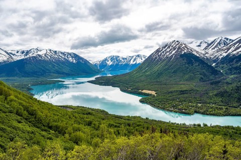 View of snowy mountains in spring and turquoise blue Kenai Lake, Slaughter Ridge Trail, Cooper