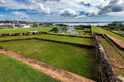 View from a fortress across an urban landscape towards a river, The fortress of Galle in Sri Lanka