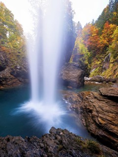 Waterfall mountain list in autumn-colored surroundings, Linthal, Klausenpass, Canton of Glarus,
