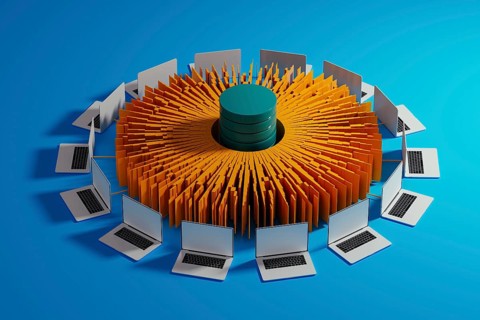 Multiple laptops surround a central data hub, showcasing technology integration for artificial