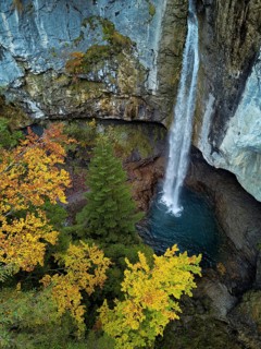 Aerial view of Berglistüber waterfall in autumn-colored surroundings, Linthal, Klausenpass, Canton