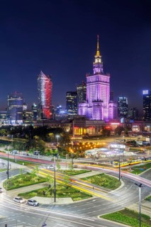 Warsaw skyline skyscrapers with Palace of Culture in the city centre at night in Warsaw, Poland